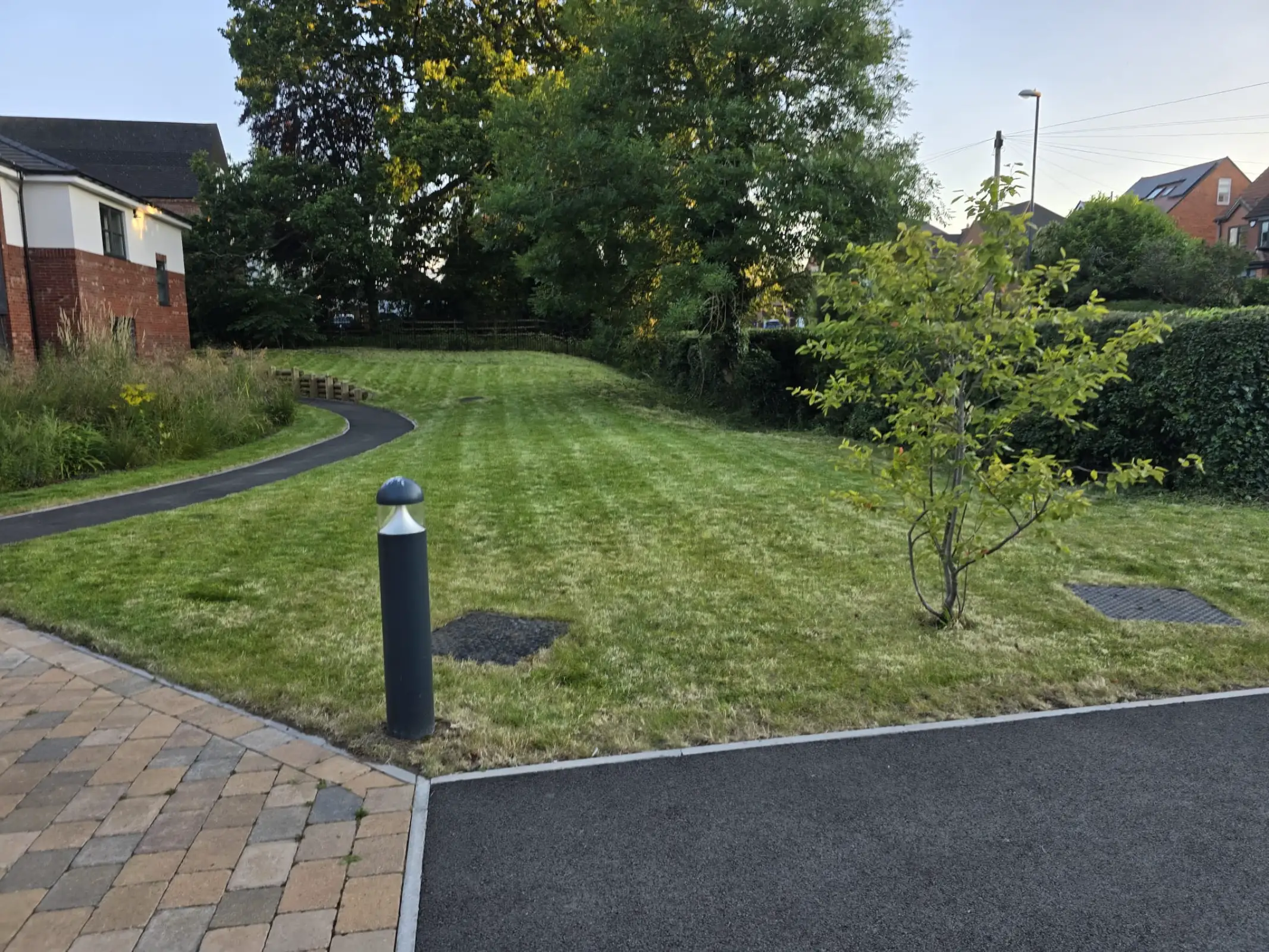 Completed garden maintenance project with a well-kept lawn and tidy borders in Derby
