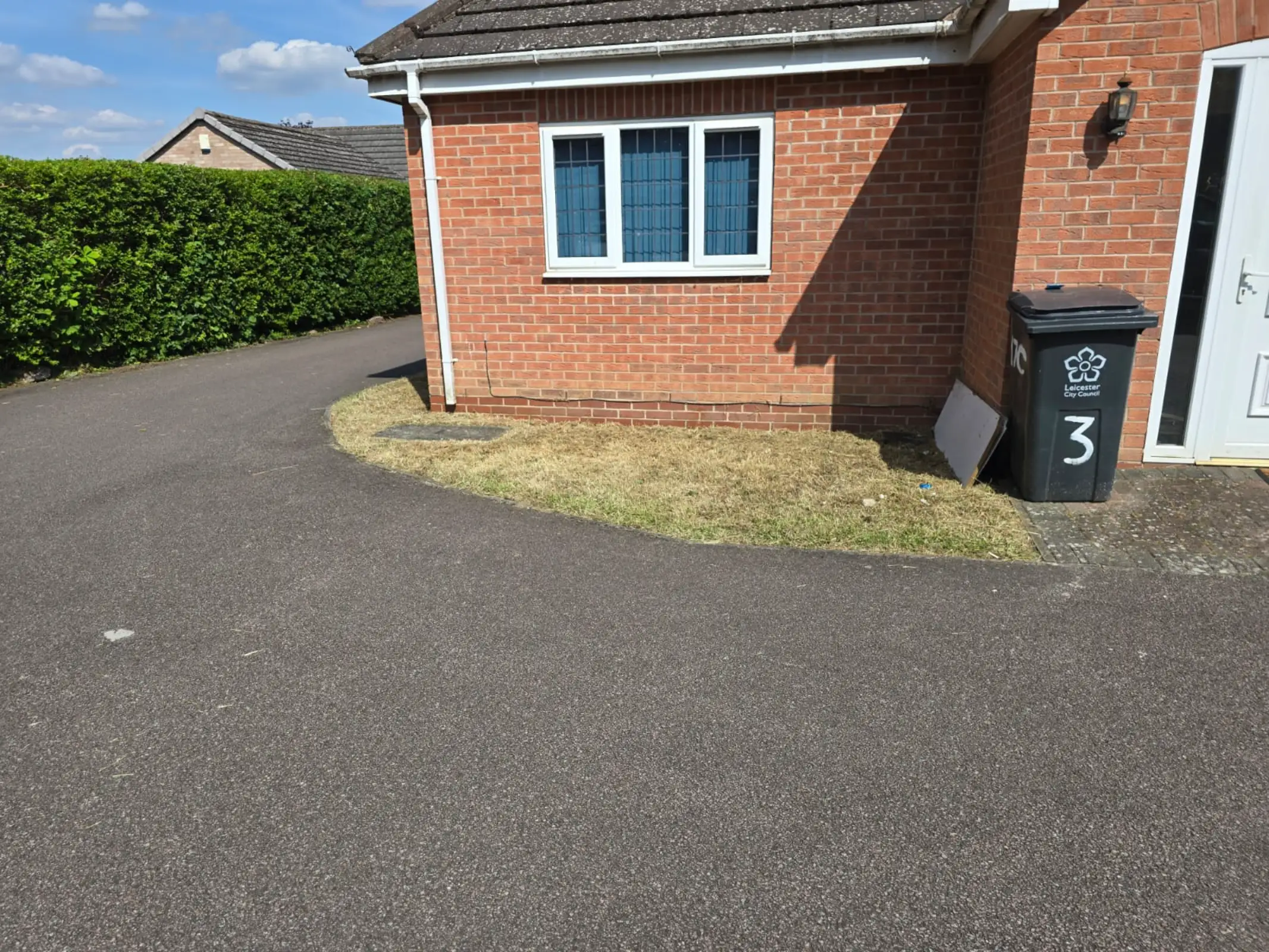 Well-kept garden with maintained lawn and tidy borders