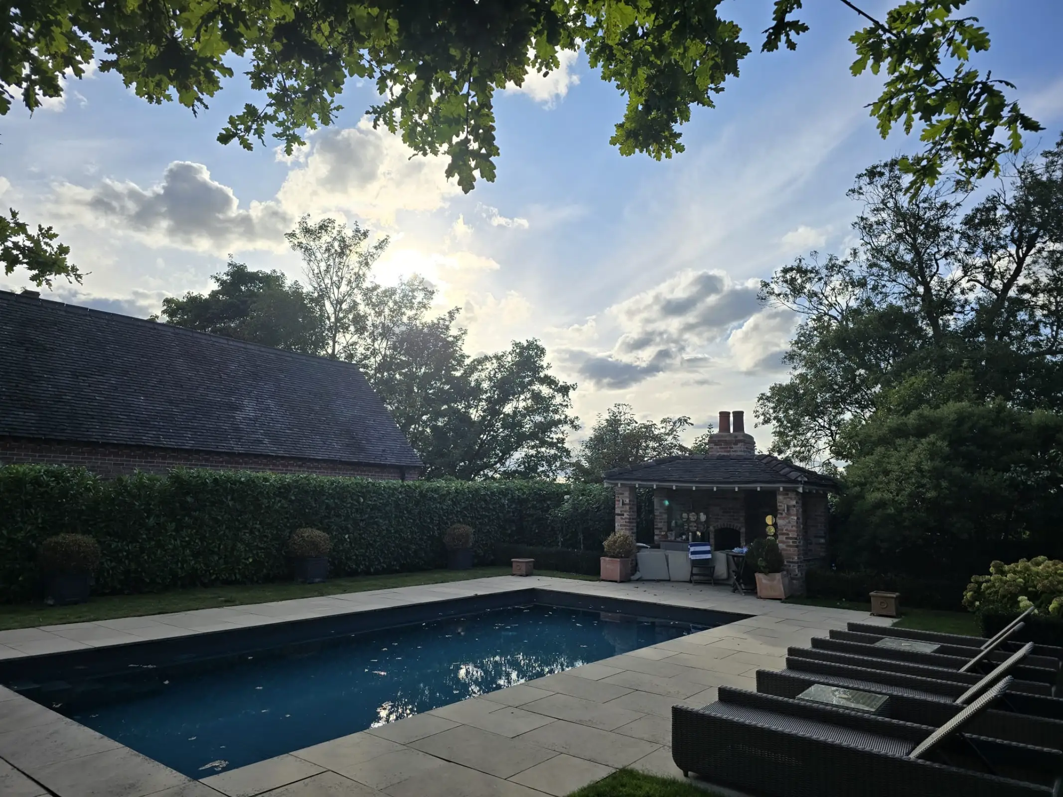 A newly completed landscaping project with a patio and new turf.
